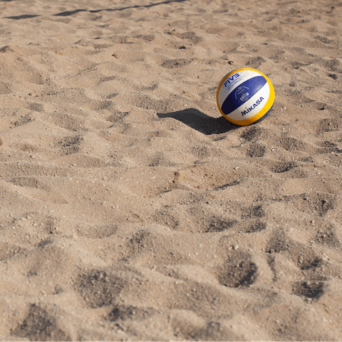 Catch a game of beach volleyball