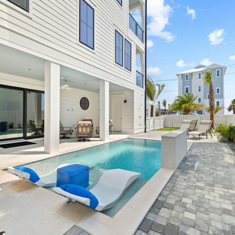 Spend the day lounging by the pool, drink in hand