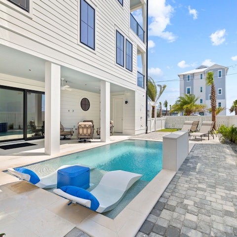 Spend the day lounging by the pool, drink in hand
