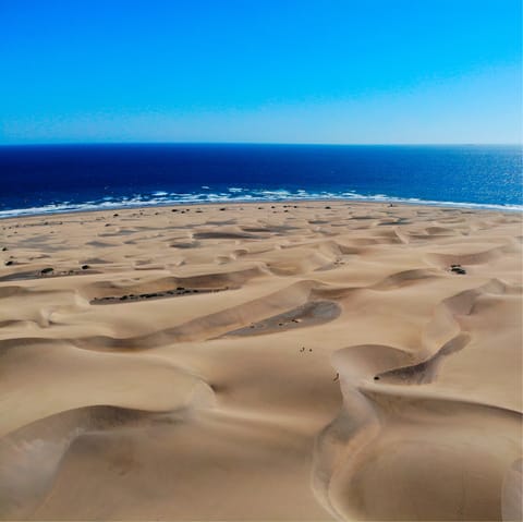 Feel the sand beneath your feet at Carabeillo beach, just 50 metres away