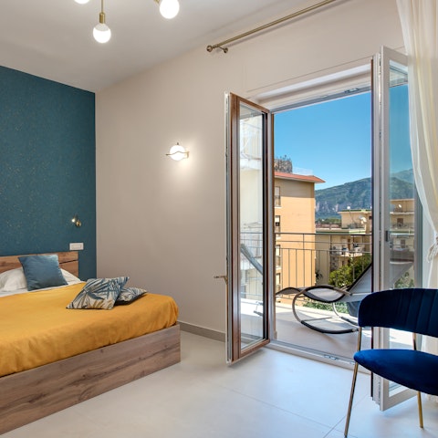 Wake up to mountain views from the elegant bedroom