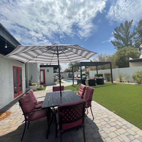 Dine alfresco with a bottle of wine in the garden