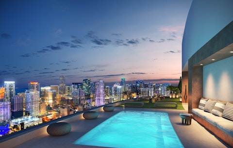 Swim above the Miami skyline as the city lights up