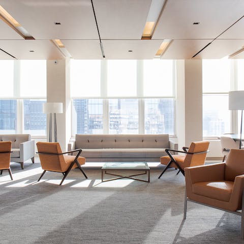Chill out in the communal lounge with its incredible floor-to-ceiling windows