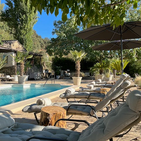 Relax with a glass of wine around the pool