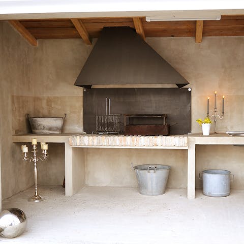 Cook alfresco to your heart's content with the covered summer kitchen