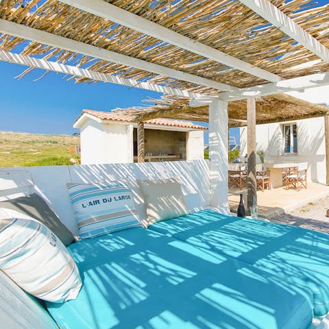 Soak up some sun on the double day bed on the terrace