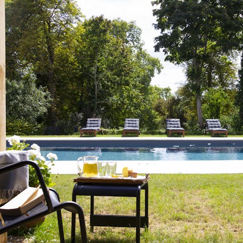 Relax by the pool, soaking up the sun with your favourite book
