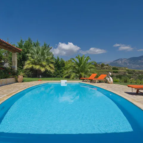 Dive into that turquoise pool under the Grecian sun