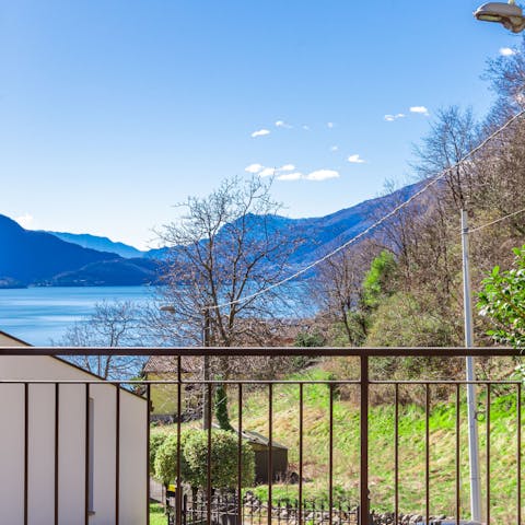 Wake up to Lake Como views from the bedroom balcony