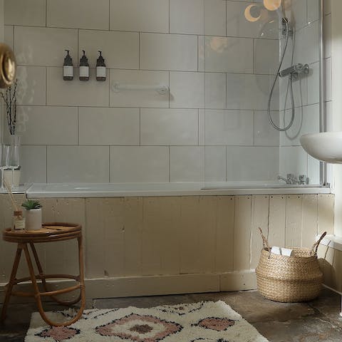 Relax and unwind with a bubble bath in the sleek bathroom