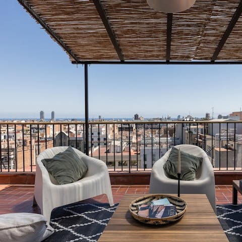 Gaze out over the rooftops all the way to the sea