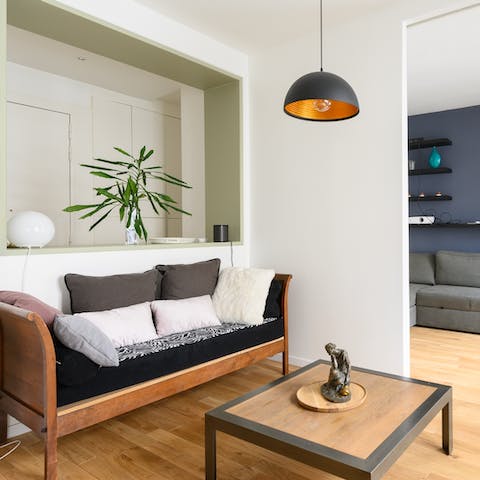 Kick back in the stylish living area with a glass of French wine after a day of Paris sightseeing