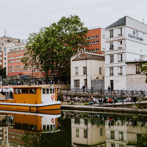 Stroll along the Canal Saint-Martin, a ten-minute walk away
