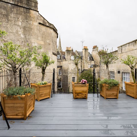 Gaze over the beautiful neighbouring buildings from the rooftop deck