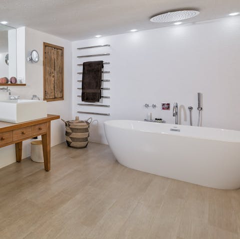Make time for a long soak in the freestanding bathtub
