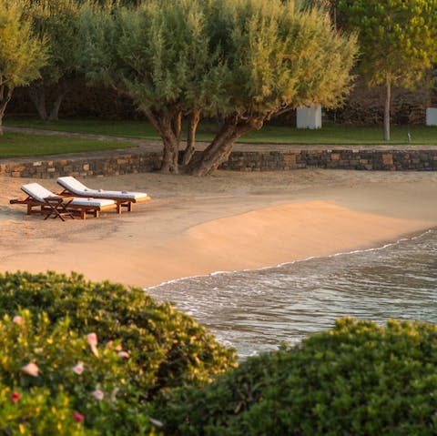 Settle down for the day on your semi-private beach, just steps from the home