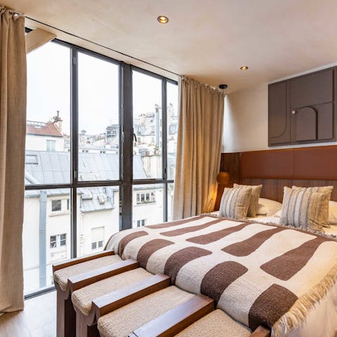 Wake up to views of the Parisian rooftops