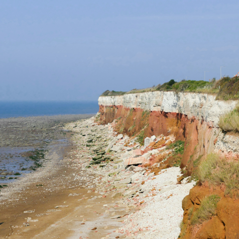 Talk a walk next to Hunstanton Cliffs, a five-minute drive away