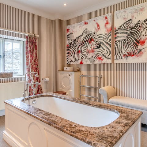 Pour yourself a glass of English fizz and go for a long soak in the freestanding bathtub