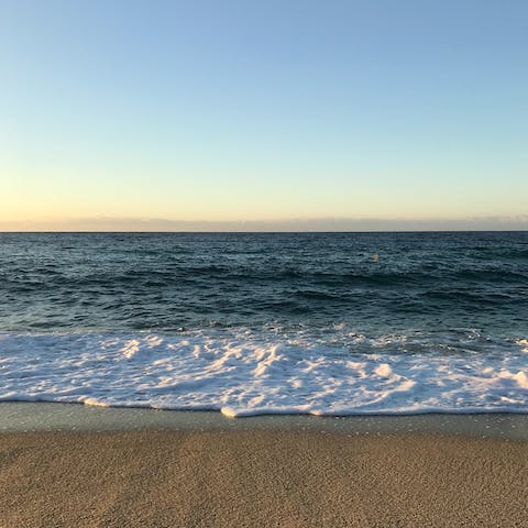 Look forward to spending hot afternoons on Oura East Beach, a short walk from the villa