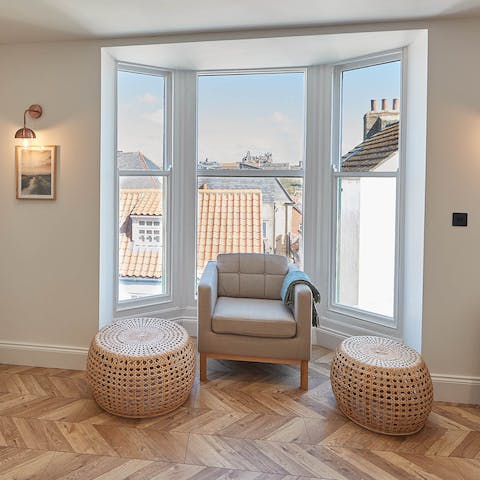 Snuggle up in the plush armchair and admire the view towards Whitby Abbey