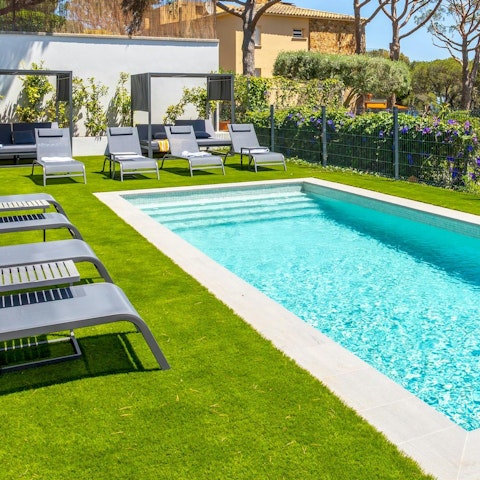 Lounge by the communal pool and soak up the sun
