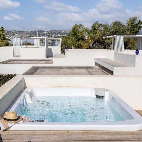 Enjoy a relaxing soak in the private hot tub
