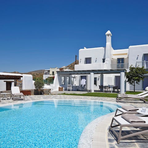 Lounge poolside and feel the Grecian sun on your skin