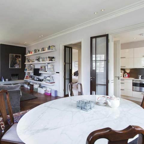 Enjoy sociable meals around the elegant marble dining table