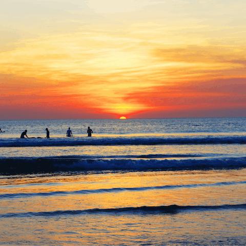 Take a stroll down the pristine white sands of Petitenget beach.