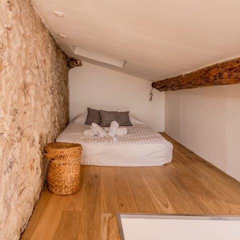 Cosy up in the mezzanine bedroom