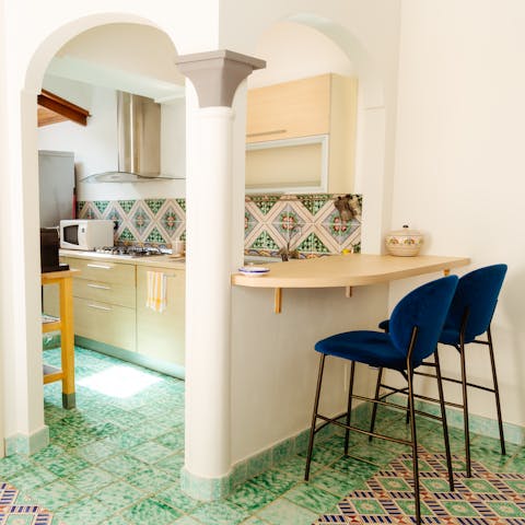 Enjoy your morning coffee under the interior arches of the kitchen