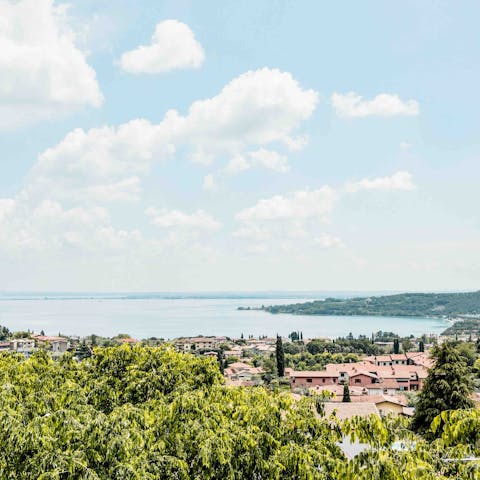 Mix an Aperol Spritz and admire the stunning views across Lake Garda