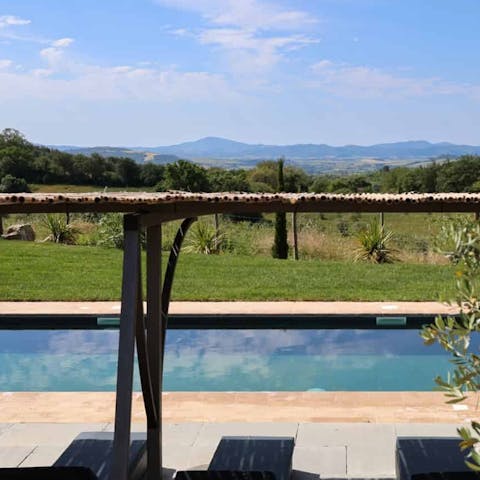 Take in the views over the Tuscan landscape from the pool