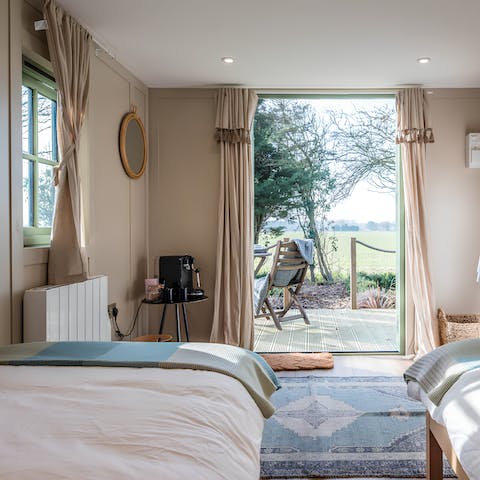 Wake up to farmland vistas with morning coffees on the private deck