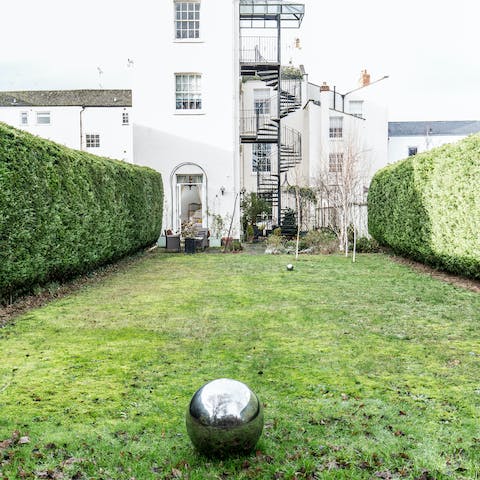Enjoy a glass of bubbly in the garden at sunset