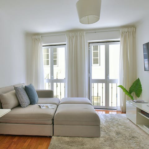 Open up the French doors to the Juliet balcony and relax on the sofa