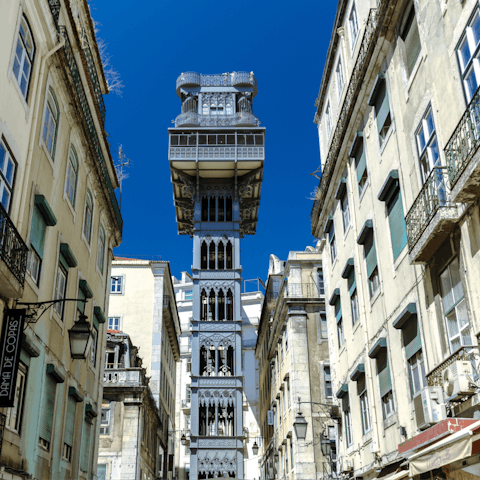 Take a ride on the Elevador De Santa Justa, a seven-minute walk away