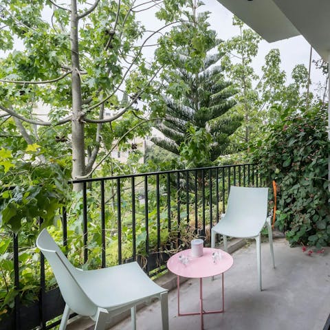 Sip your morning coffee on the tree-lined balcony