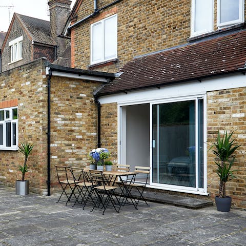 Dine outdoors on the home's patio