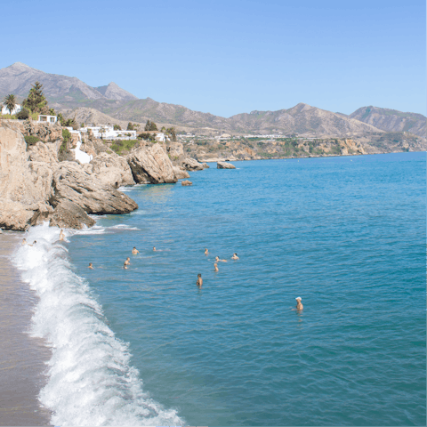 Take a paddle boarding lesson off Playa de Nagüeles, a short walk away