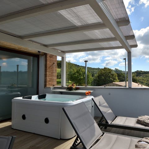 Relax in the private hot tub as the sun warms your skin