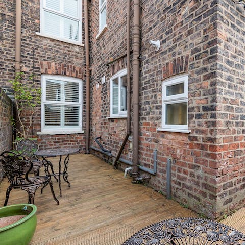 Sip your morning cuppa in the patio garden