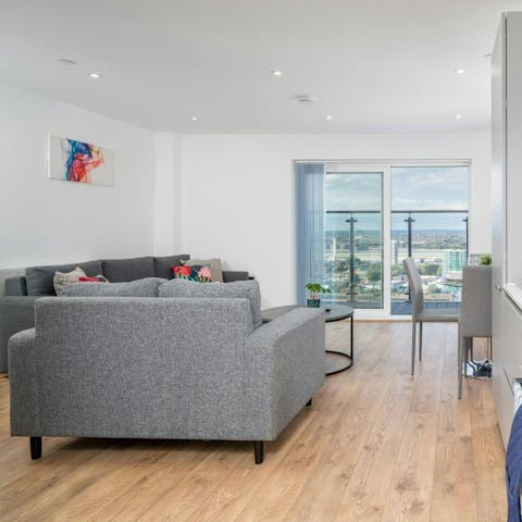 Unwind in the bright living area with a glass of wine and Netflix