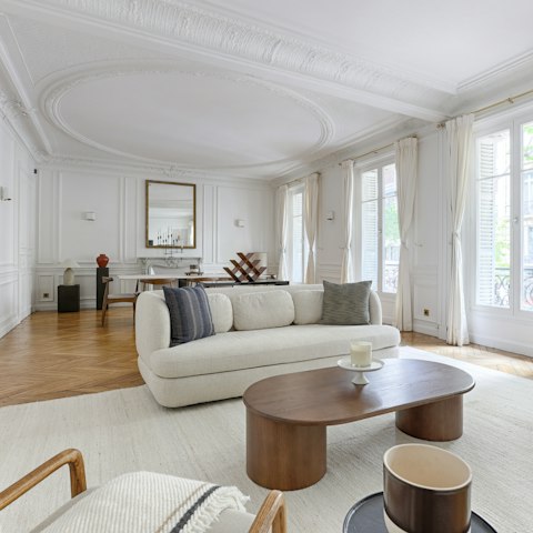 Have a glass of Champagne in the impressive living room