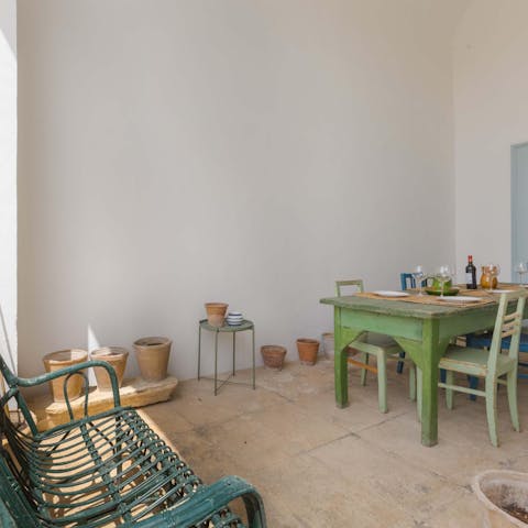 Sit down for sociable family meals on the covered terrace