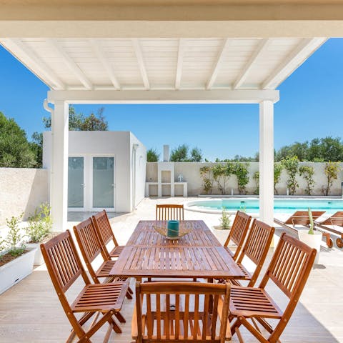 Sit down for an alfresco lunch and a bottle of Italian wine on your covered terrace