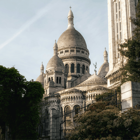 Marvel at the iconic Sacré-Cœur Basilica, seven minutes away