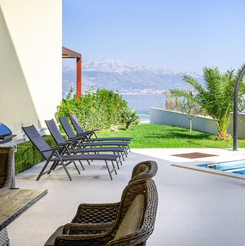 Sprawl out on the sun loungers, cocktail in hand, and admire the views